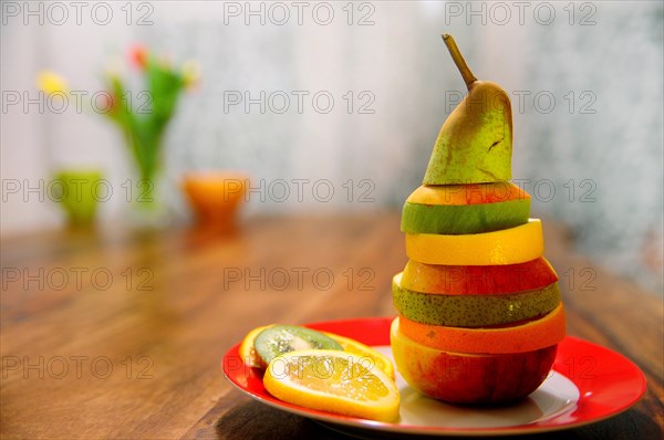 Slices of different fruits layered on top of each other