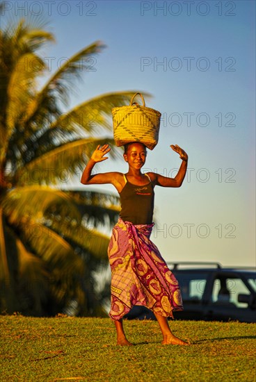 Woman wit ha basket on her head