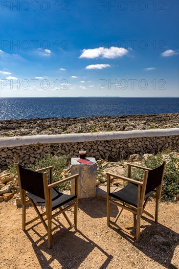 Two chairs overlooking the sea