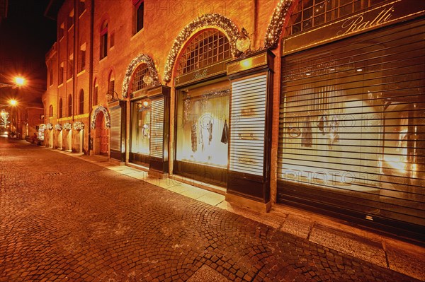 Shop window in the pedestrian zone with Christmas lights