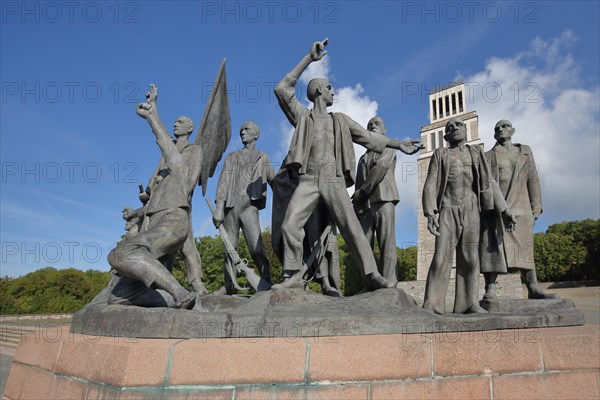 Group of figures by Fritz Cremer with bell tower