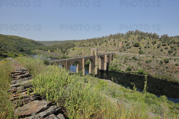 Landscape with Puente Romano and river Alcantara