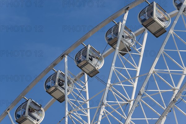 Gondolas of a Ferris wheel at the harbour