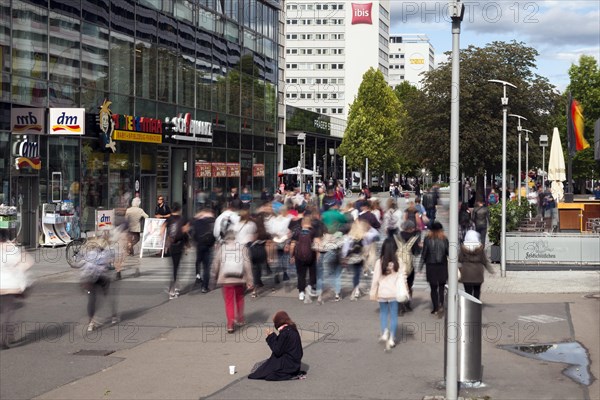 Beggar woman in the pedestrian zone Prager Strasse in the city centre