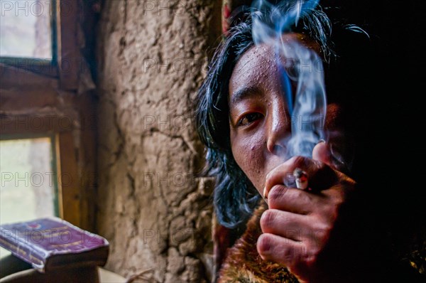 Monk smoking in a monastery