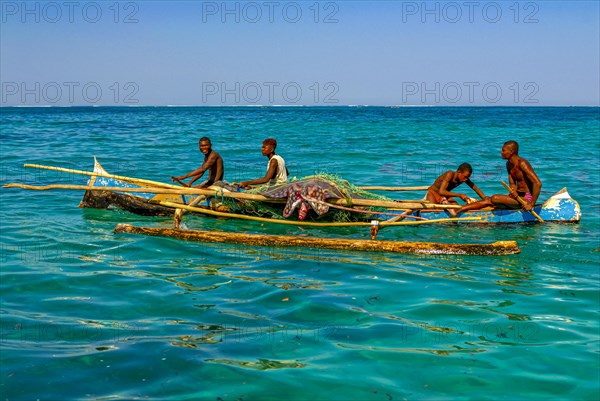 Traditional sailing boat and rowing boat with a dead