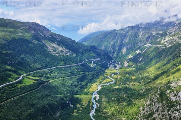 View from the Rhone glacier of the glacial stream and the pass roads