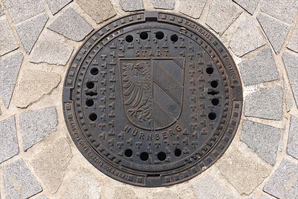 Manhole cover with the Nuremberg city coat of arms