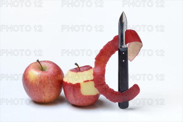 Peeled apple with peeling knife