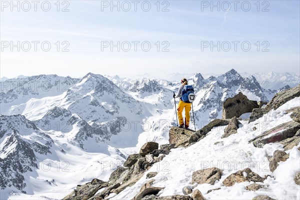 Mountaineer at the summit of the Sulzkogel