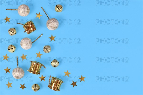 Christmas flat lay with golden ornaments like small drums
