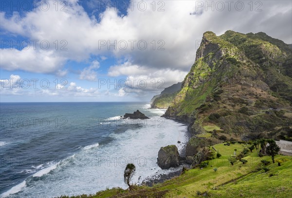 View of steep cliffs and mountains on the coast with sea