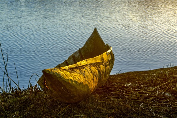 Wooden canoe at sunset