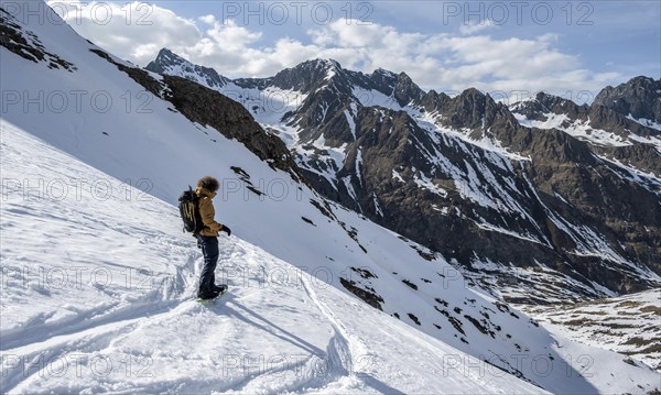 Snowboarders in the mountains in winter