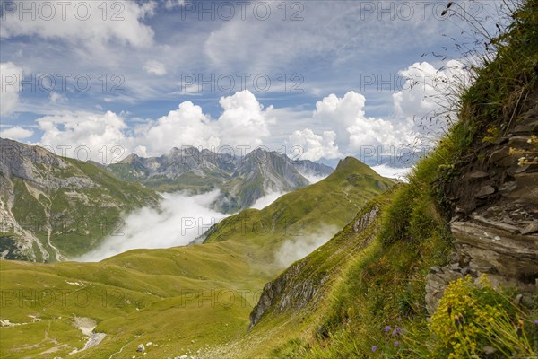 View from Gehrengrat over the fog-shrouded peaks of the Alps. Lech