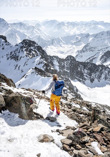 Mountaineer at the summit of the Sulzkogel