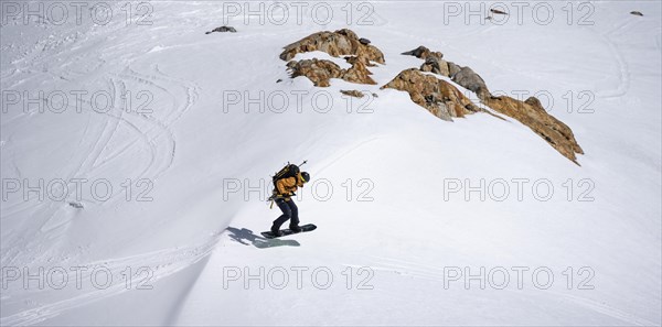 Splitboarder jumps