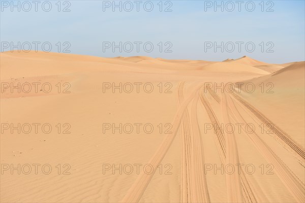 Car tracks in the sandy desert of Dubai