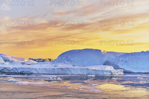 Gigantic icebergs in the evening light