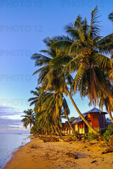 Bungalows at sunset on a beach on the Island Ile Sainte Marie