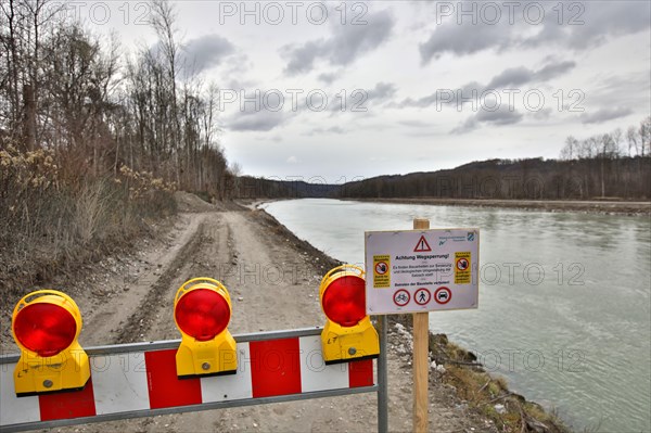 Closed construction site access road along a river