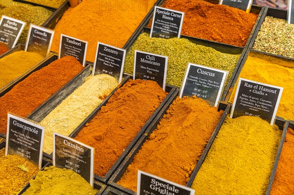 Spices in rectangular containers at the weekly market market in Portoferraio