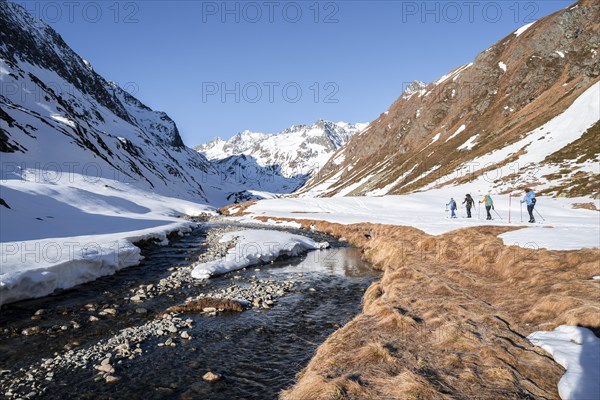 Ski tourers in Oberbergtal with Oberbergbach