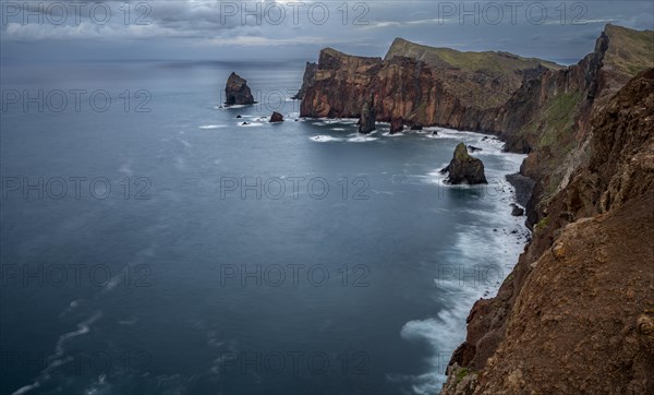 Red cliffs and rocks in the sea