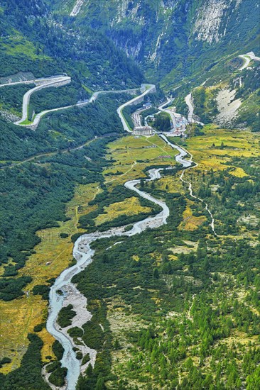 View from the Rhone glacier of the glacial stream and the pass roads