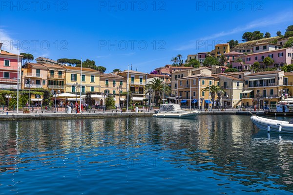 Boats anchor in the harbour of Porto Azzurro