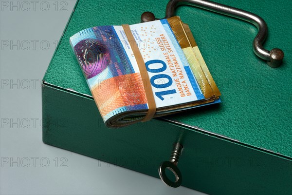 Cash box and Swiss banknotes