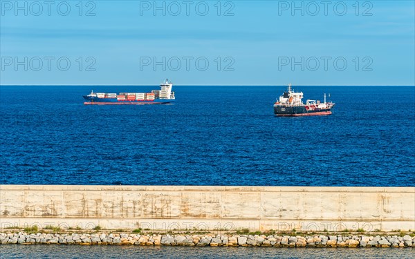 Oil Tanker and Container Ship at sea with Barcelona in the background
