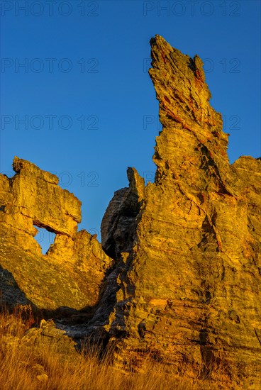 Savannah and huge rock formations at sunset in the Isalo National Park