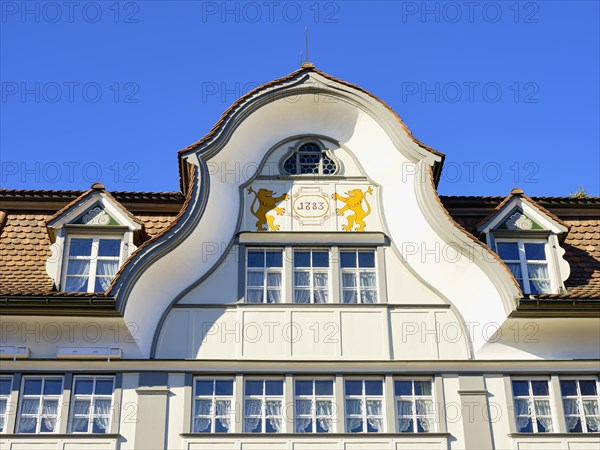Roof hatch of a typical Appenzell house with wooden facade