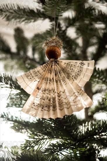 Handmade Christmas angel on christmas tree