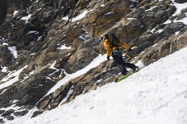 Splitboarders descending a steep slope