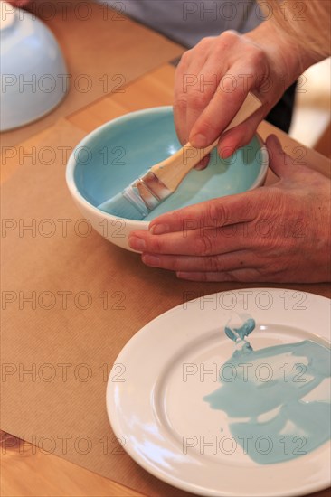 A bowl is painted and decorated