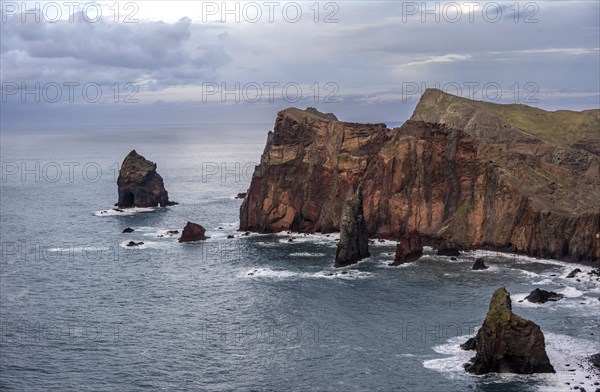 Red cliffs and rocks in the sea