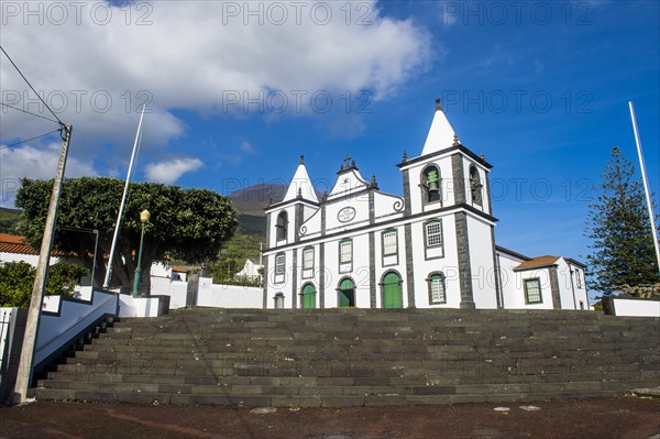 Paroquia de Sao Mateus church below Ponta do Pico highest mountain of Portugal