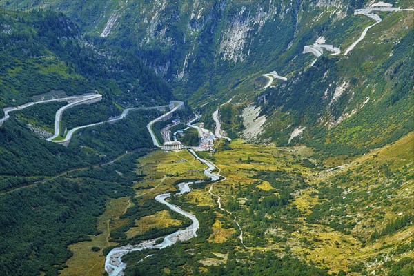 View from the Rhone glacier of the glacial stream and the pass roads