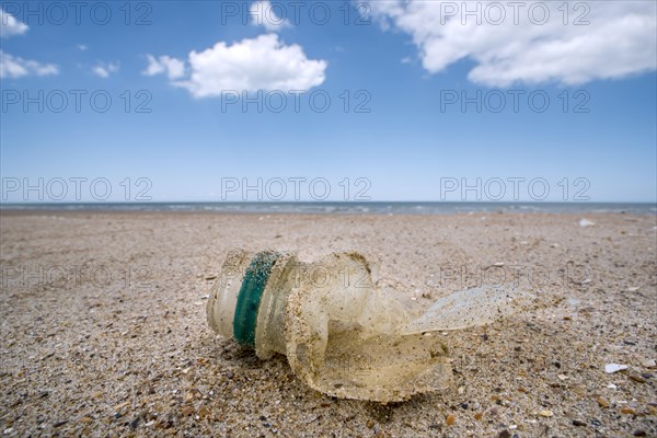 Old partly broken down plastic bottle