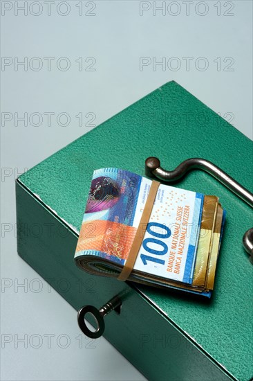 Cash box and Swiss banknotes