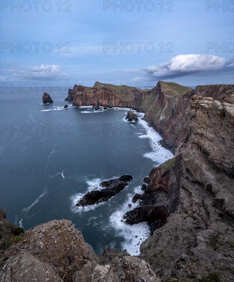 Red cliffs and rocks in the sea