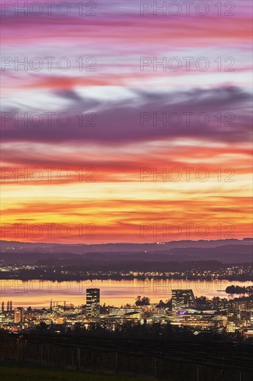 Evening mood with skyline and Lake Zug in the foreground the skyscrapers Parktower and Uptown