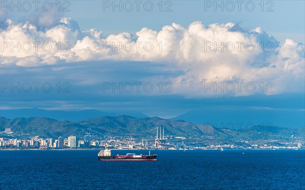 Oil tanker at sea with Barcelona in the background