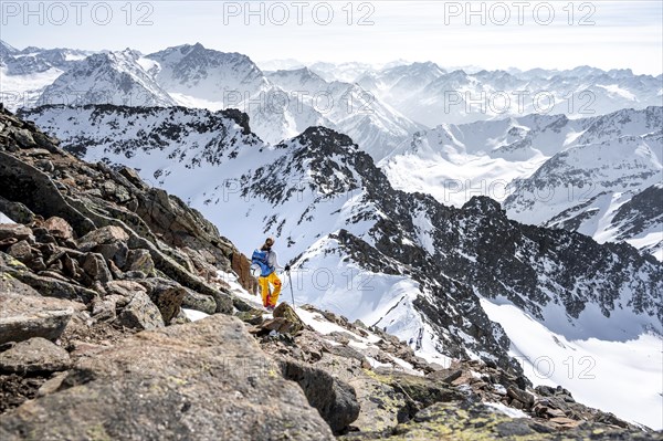 Mountaineer at the summit of the Sulzkogel