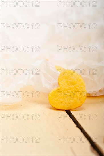 Fresh baked heart shaped shortbread valentine day cookies on a paper wrap