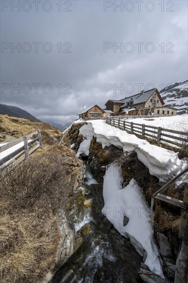 Oberbergbach gorge and Franz-Senn-Huette mountain hut in winter