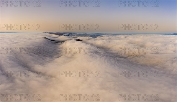 Aerial view over the sea of fog in the Central Plateau with Sahara dust in the air