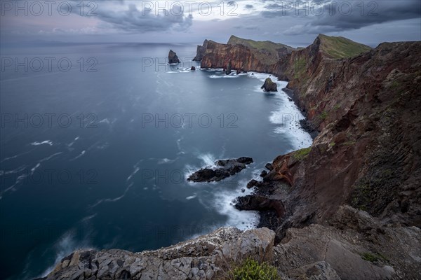 Red cliffs and rocks in the sea